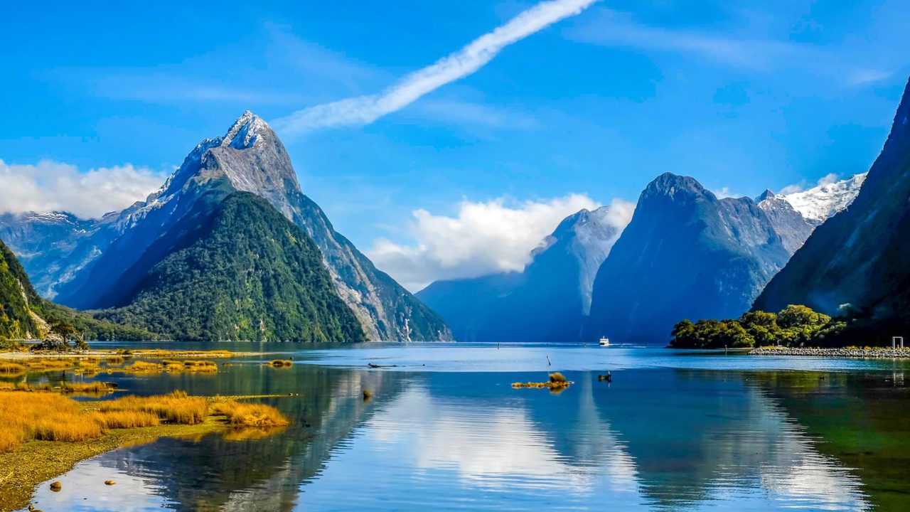 https://dev.travelonica.com/wp-content/uploads/2023/08/Explore-the-stunning-fjords-of-Milford-Sound-1280x720.jpg