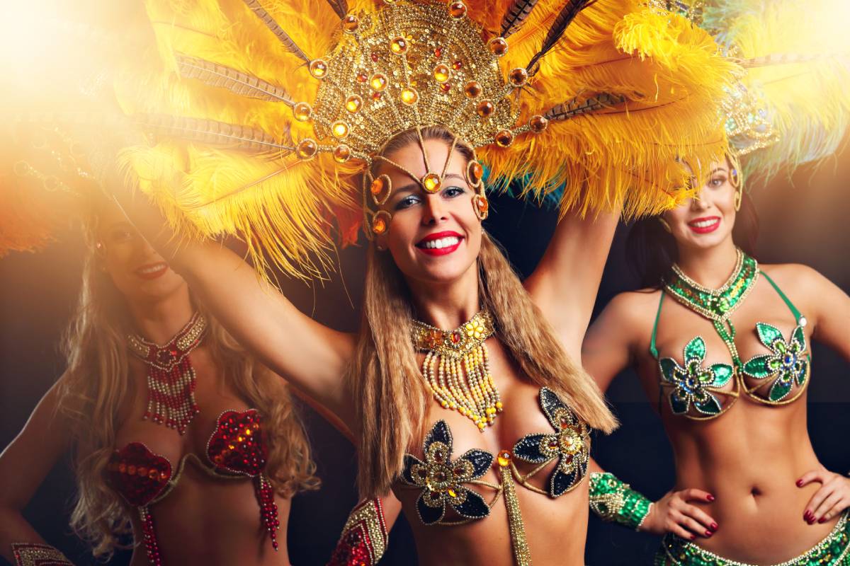 https://dev.travelonica.com/wp-content/uploads/2024/09/brazilian-women-dancing-samba-at-carnival-2023-11-27-04-53-12-utc-1.jpg